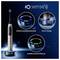 Promotional image of an iO Sense electric toothbrush showing position detection, cleaning timer, and pressure control with illuminated display indicators.
