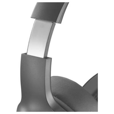 Close-up of a black over-ear headphones earcup and adjustable headband on a white background.
