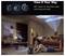 Advertisement for a 360° rotating projector, shown tilting to project movies onto wall and ceiling in a cozy living room.