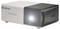 A Denver projector with a lens illuminated on the front, shown in white and black casing.