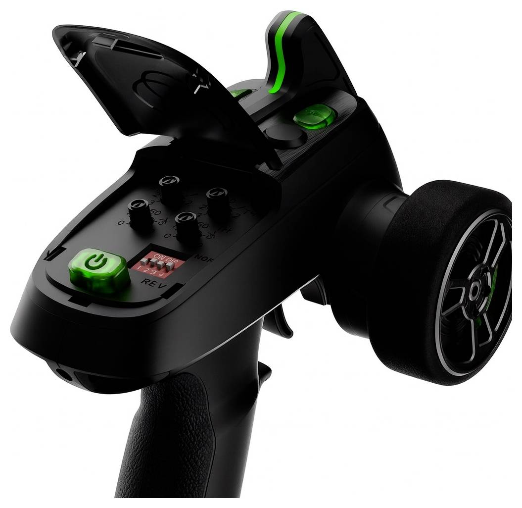 Black handheld remote controller with green accents, trigger grip, wheel, and raised top cover on a white background.