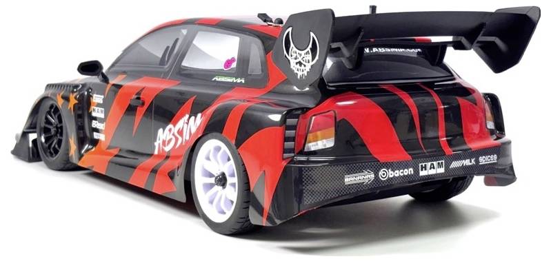 Red and black modified race car with large rear wing, shown from the rear-left side on a white background.