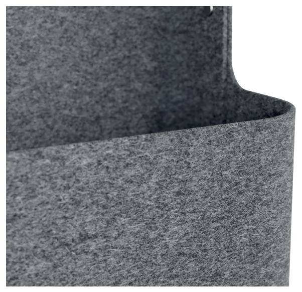 Close-up of a gray felt storage bin or basket with a curved top edge and textured fabric sides.<br>