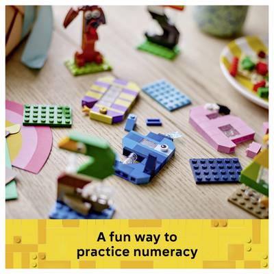 Colorful LEGO pieces scattered on a table above a banner reading 'A fun way to practice numeracy'.