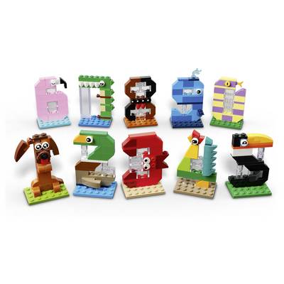 Nine colorful LEGO-style animal figures arranged in two rows on a white background, each built from blocks and resembling a different creature.
