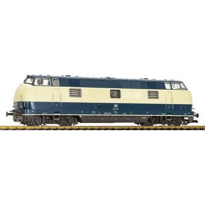 Side view of a cream and dark green diesel locomotive on train tracks, with a driver visible in the cab.