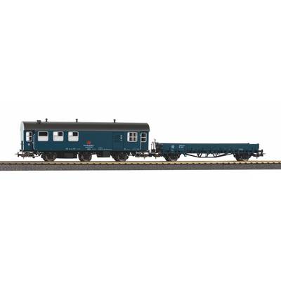 Model railway flatbed and passenger coach on track, shown side by side on a white background.