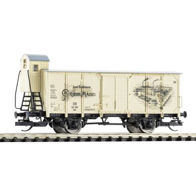 Vintage cream model boxcar on railroad track, with a small cupola end and black undercarriage, shown side view on a white background.