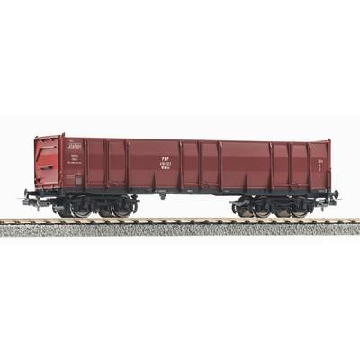 Side view of a red rail freight wagon on tracks against a white background.