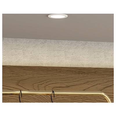Close-up of a wall with a textured white upper section, wood-grain lower panel, and a brass handrail below a ceiling light.
