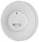 Round white smoke detector viewed from the back, showing a battery compartment, mounting keyhole, and test/reset button.