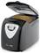 Black automatic bread maker with lid open, showing a baked loaf inside and a front control panel with digital display.
