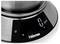 Close-up of a Tristar digital kitchen scale displaying 0 g, with unit and lock icons on the black control panel.<br>