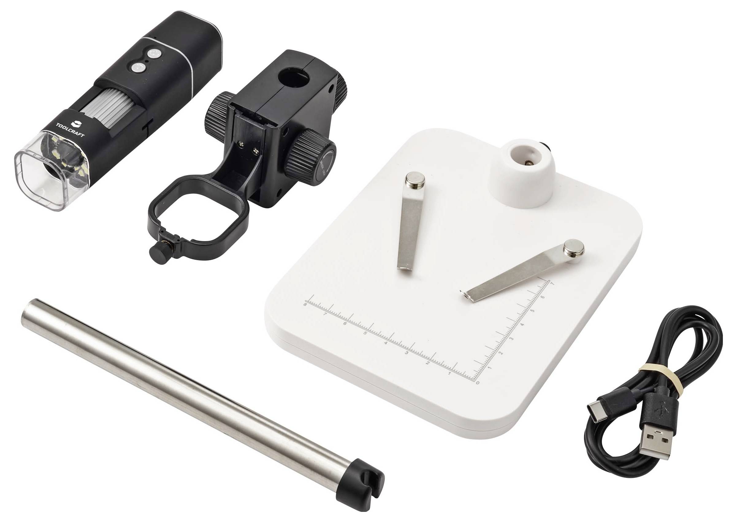 A digital microscope kit with two microscope attachments, a white base stand with measurement guide, a metal rod, and a USB cable on a white background.