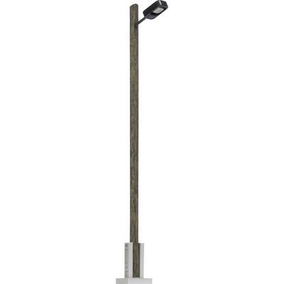 A wooden utility pole with a mounted streetlight fixture on a white background.