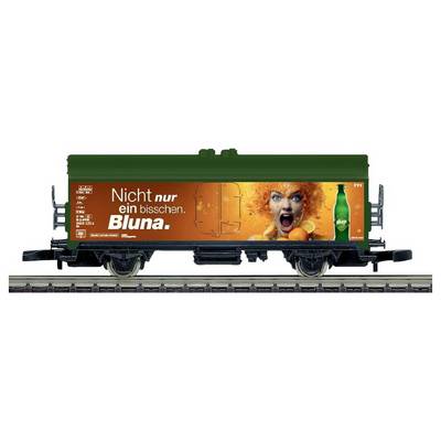 A green train freight car with an orange Bluna ad showing a shouting woman and the slogan 'Nicht nur ein bisschen. Bluna.'