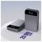 Two gray Anker portable power banks, one upright and one lying flat, labeled 20000 mAh, shown on a white surface.<br>
