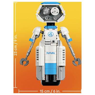 Front-view LEGO-style robot figure with claw hands on an orange background, labeled as 23 cm/9 in tall and 15 cm/6 in wide.