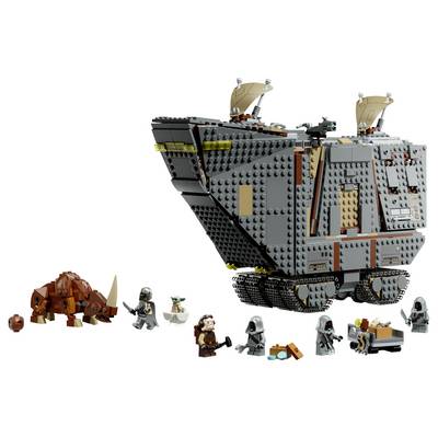 LEGO Star Wars scene with a large gray armored walker/ship and an orange beast, plus several minifigures and small accessories on a white background.