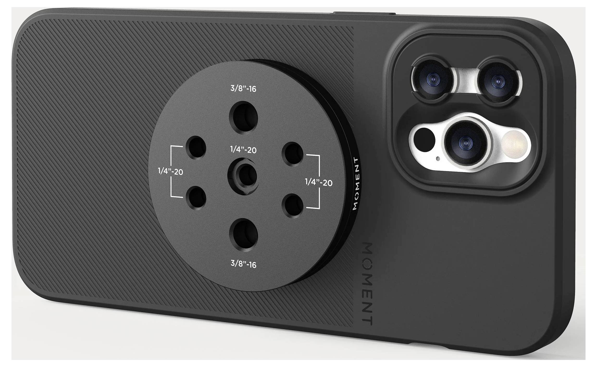 Black smartphone case with a circular multi-mount attachment plate and triple-camera cutout, shown on the back of an iPhone-style phone.<br>