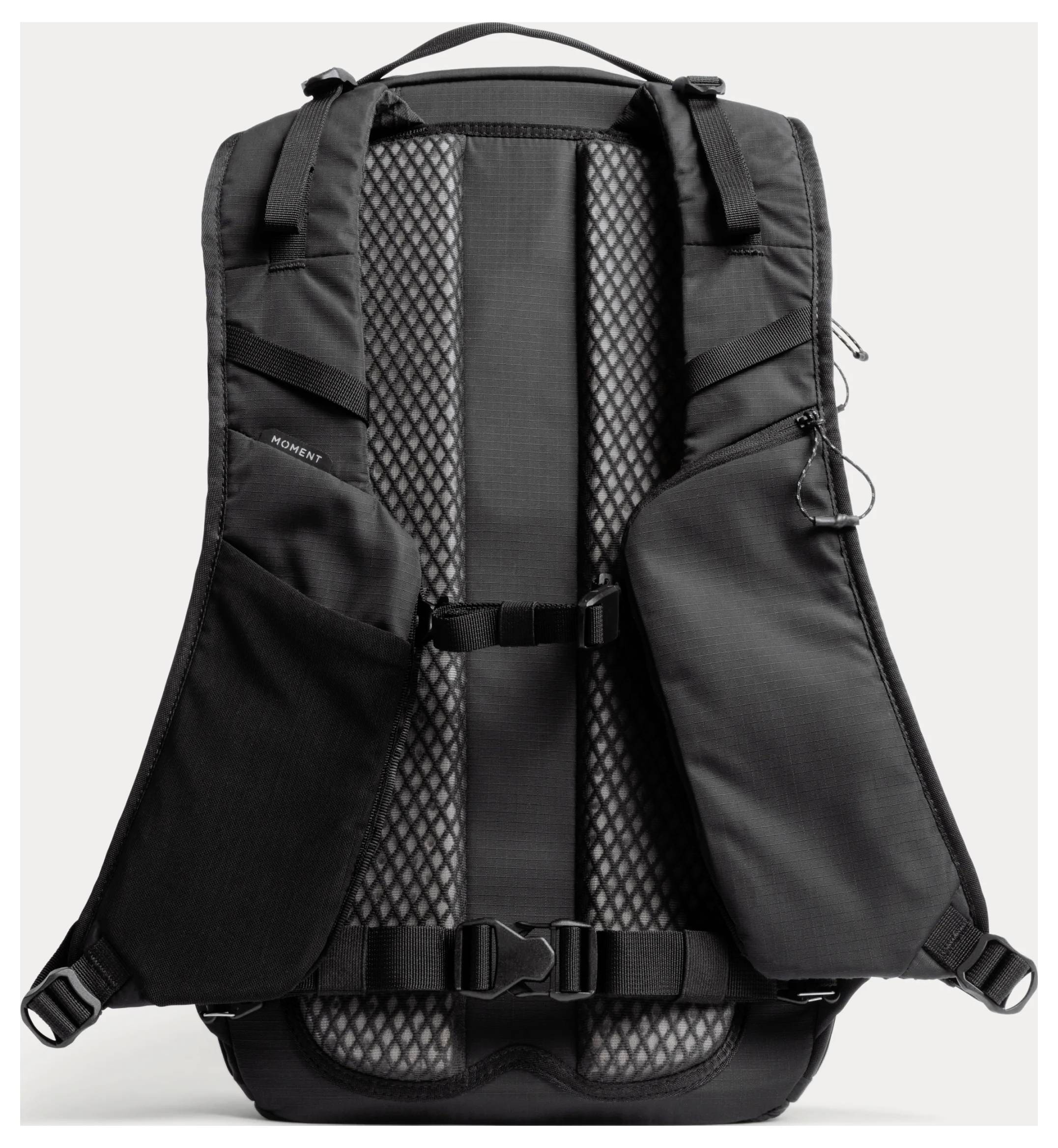 Black backpack shown from the back, with padded mesh back panel, shoulder straps, chest strap, and side pockets.