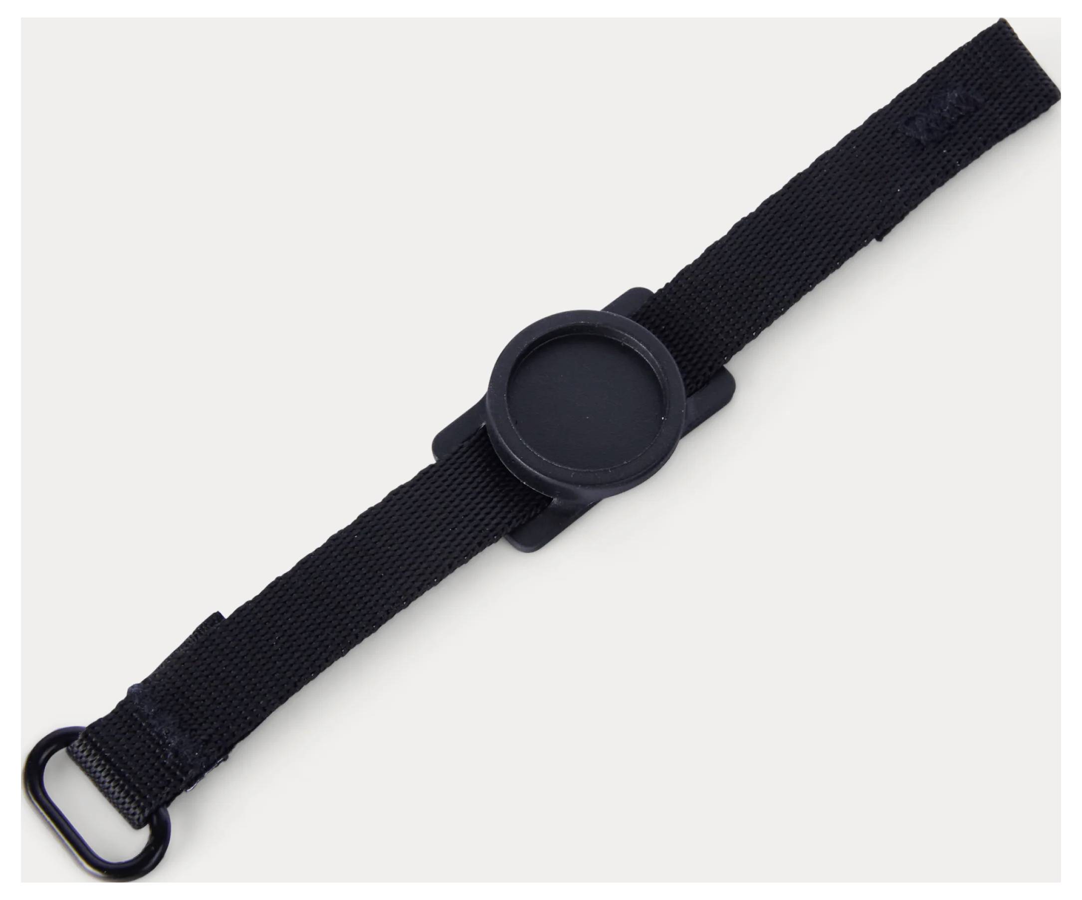 Black strap with a round central clasp and metal loop, shown on a plain light background.