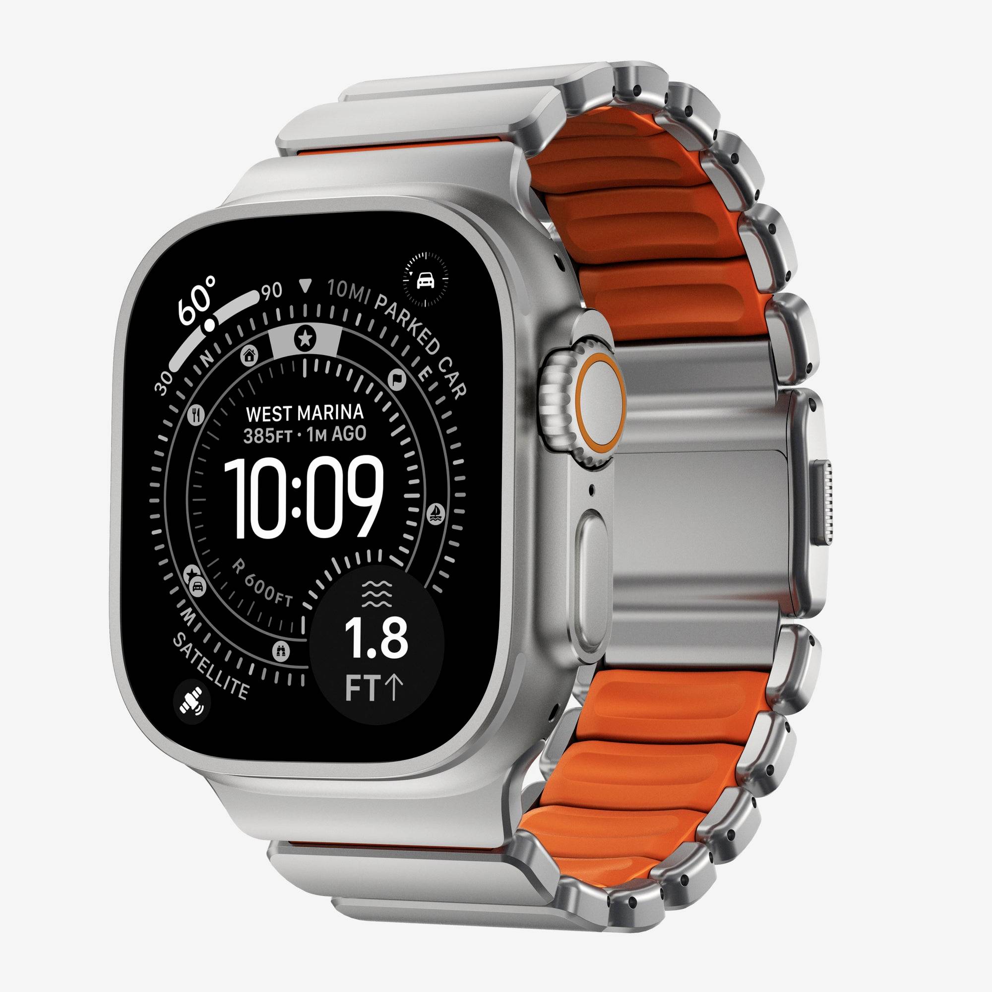 Silver Apple Watch Ultra with orange band, showing a dark analog-style compass watch face and the time 10:09.<br>