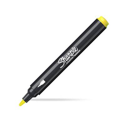Black Sharpie Creative Marker with yellow cap and tip, shown diagonally on a white background.