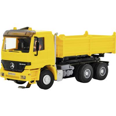 Yellow Mercedes-Benz dump truck toy on a white background, shown in side view with raised cargo bed and six wheels.