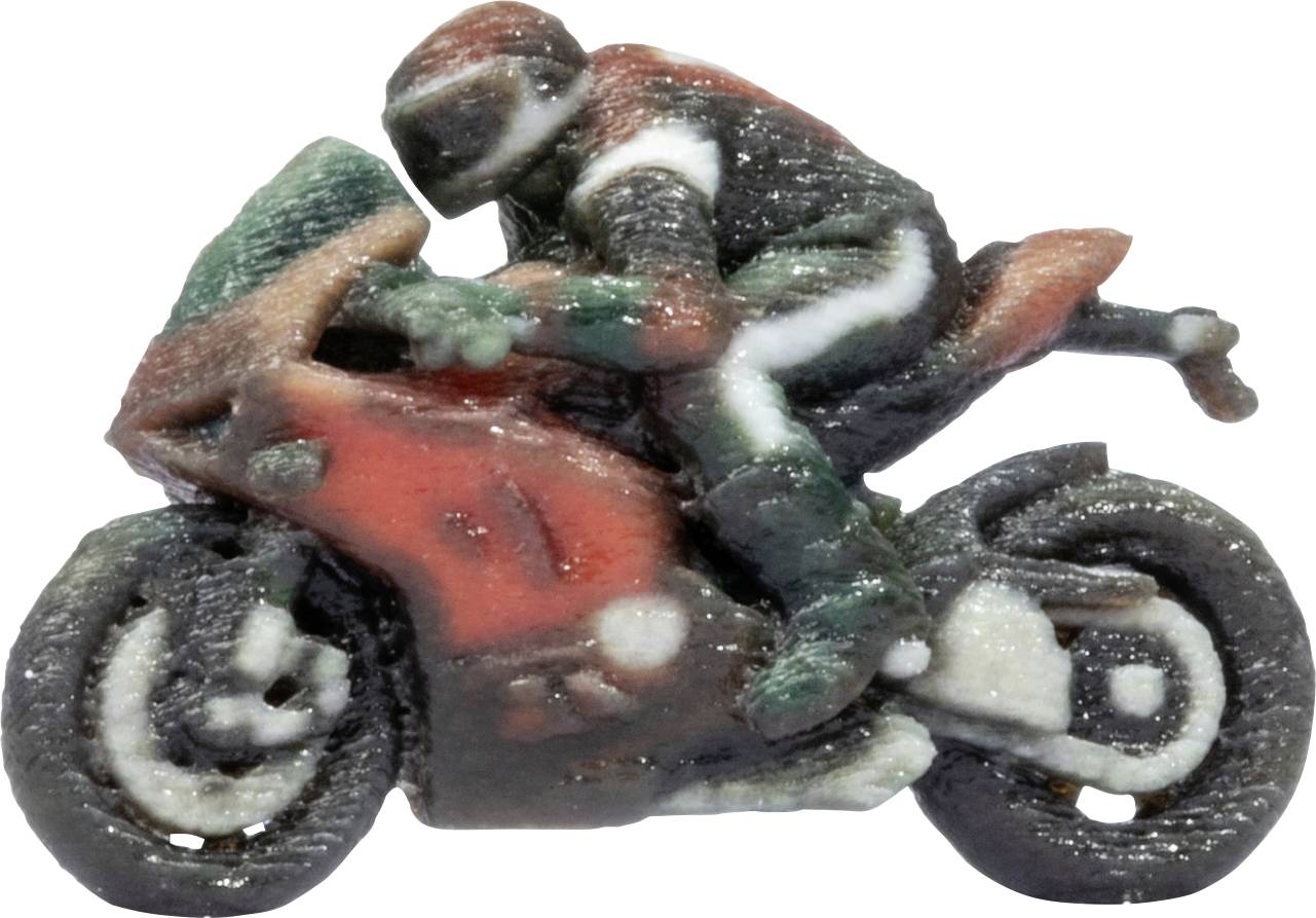 Miniature toy motorcycle with a rider leaning forward, painted red, green, and black, isolated on a white background.