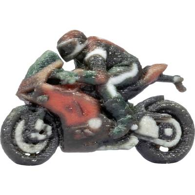 Miniature toy motorcycle with a rider leaning forward, painted red, green, and black, isolated on a white background.