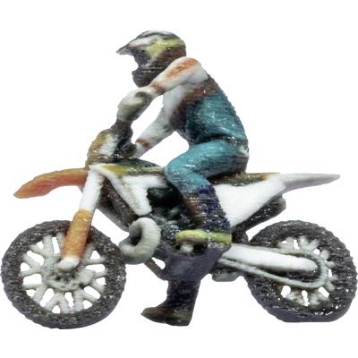 Miniature figure of a rider on a dirt bike, viewed from the side on a white background.