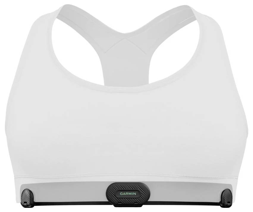 White sports bra with a Garmin heart rate monitor clipped at the lower front center.<br>