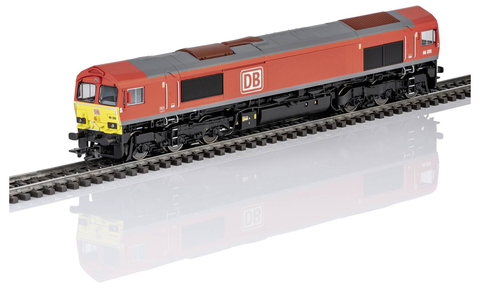 Red DB diesel locomotive model on a single railway track, shown in profile on a white background.<br>