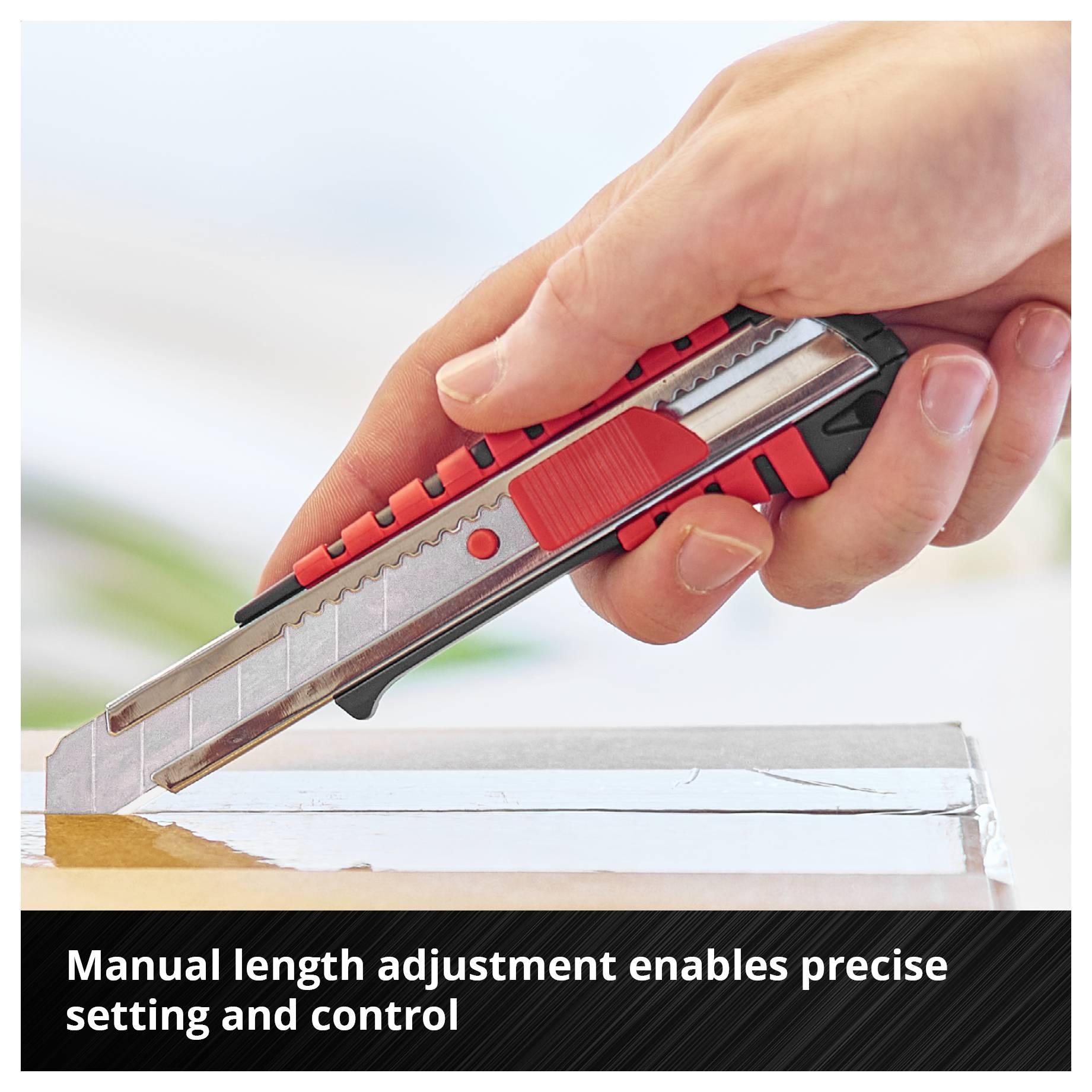 Hand holding a utility knife and adjusting the blade length precisely; Image caption: 'Manual length adjustment enables precise adaptation and control'