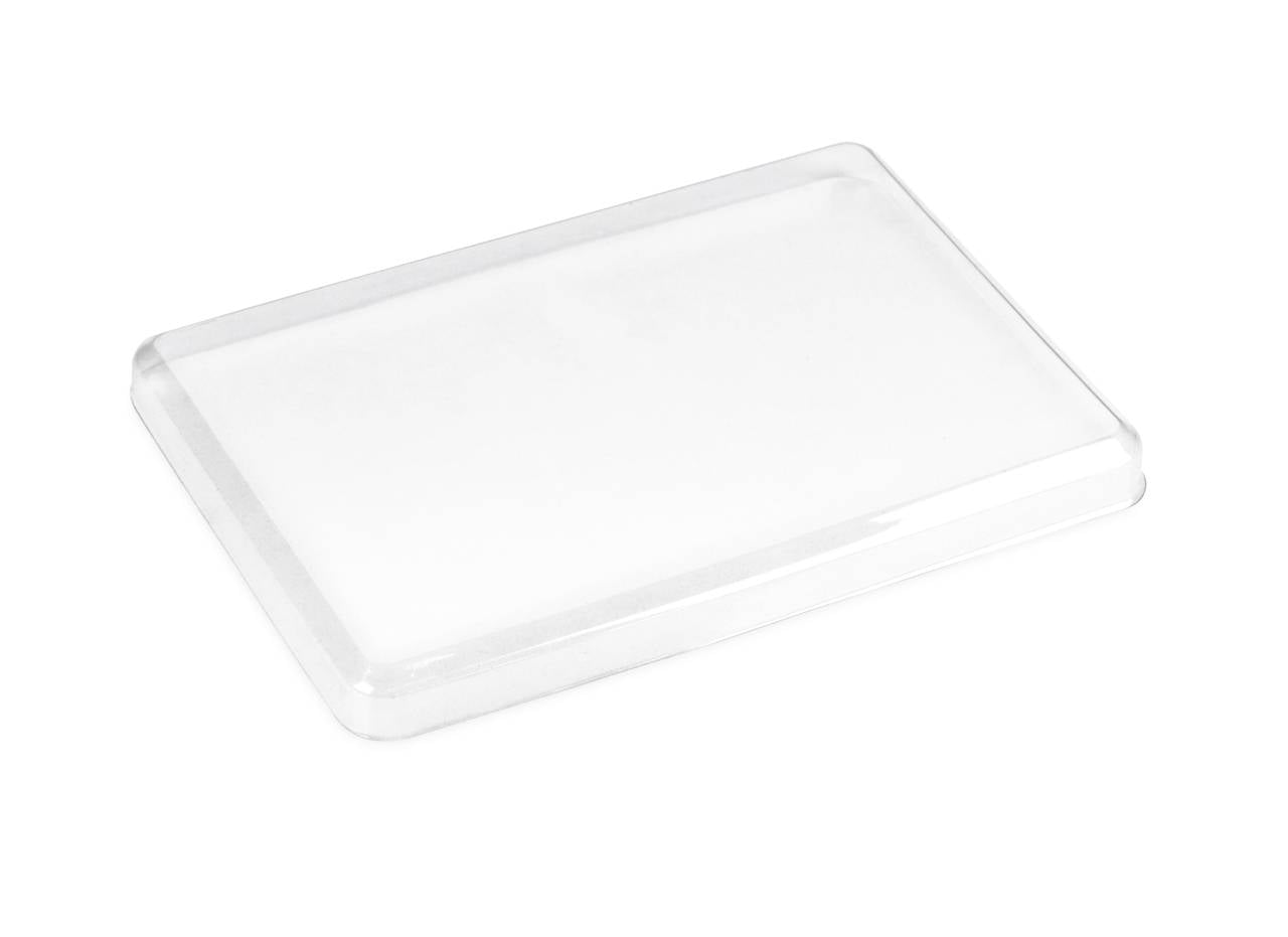 Clear empty rectangular plastic tray or lid on a white background.