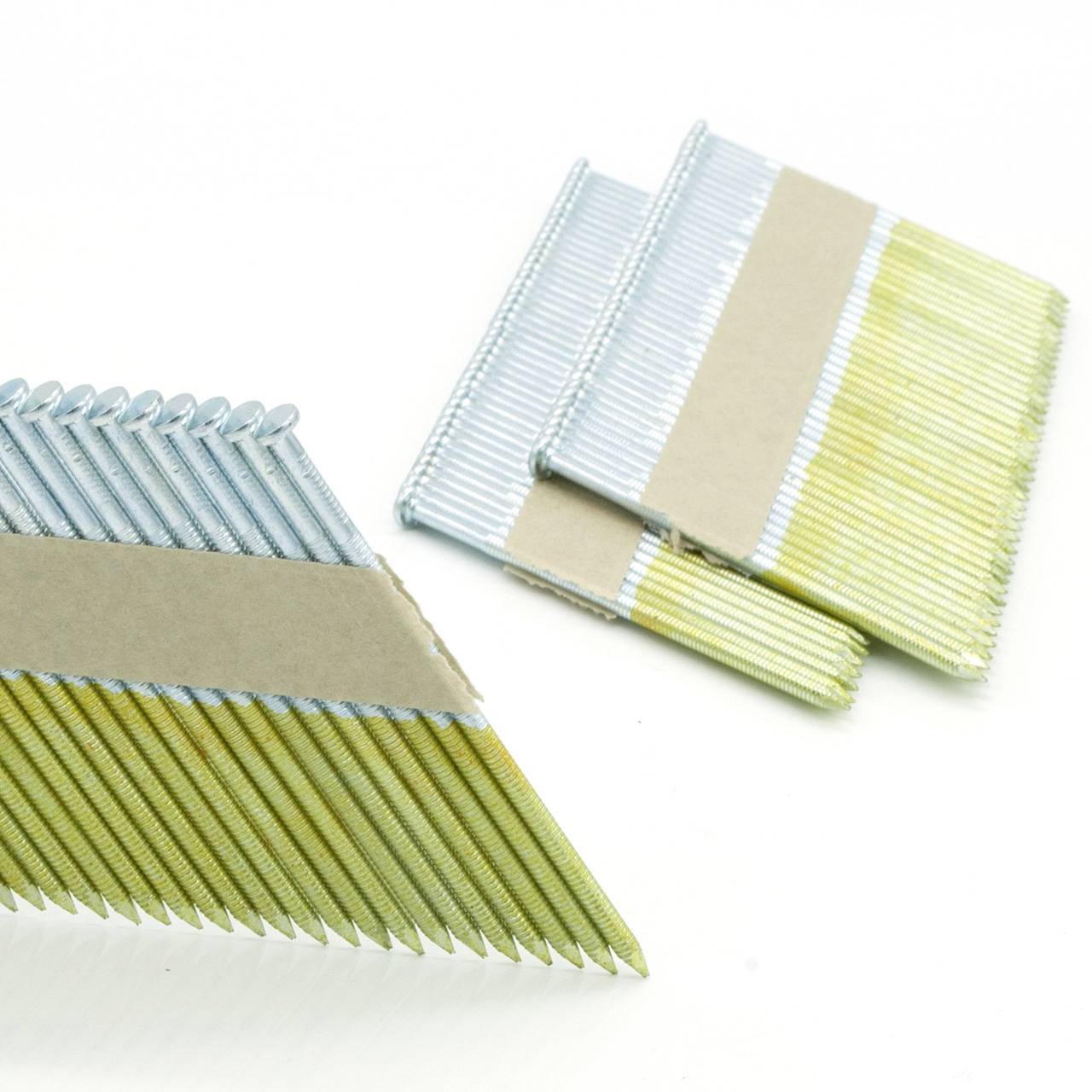 Bundles of color-coded brad nails/finish nails on a white background, tied together with cardboard bands.