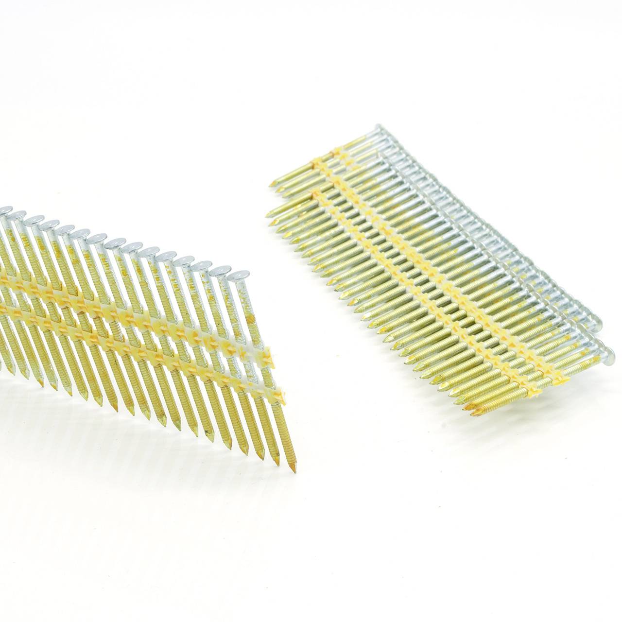 Two overlapping rows of gold-colored collated nails or fasteners on a white background, shown at slight angles.<br>