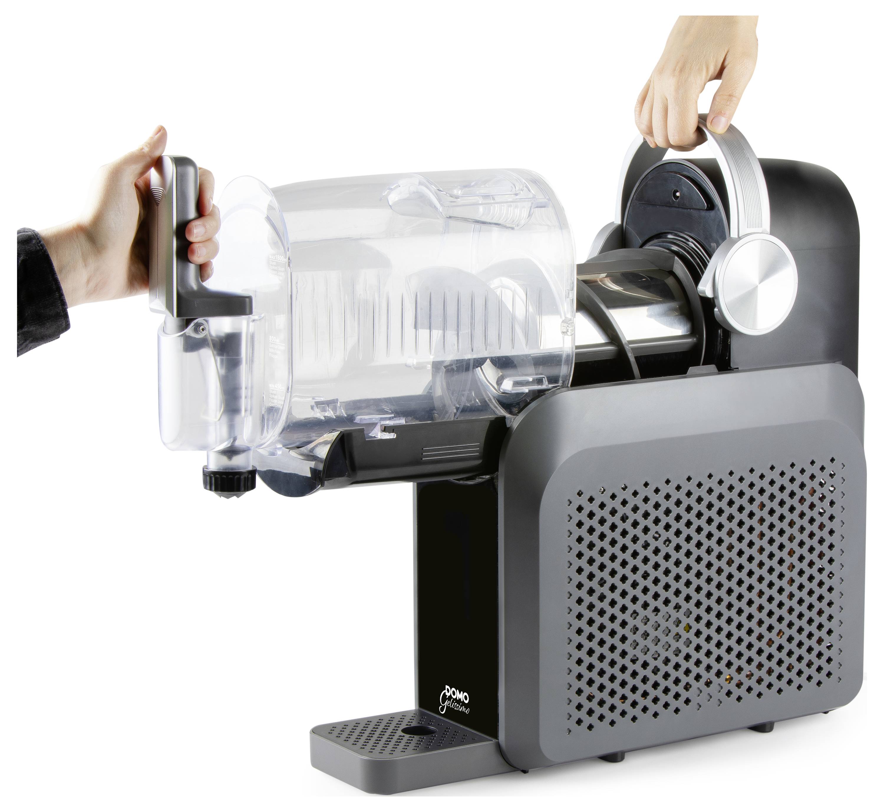 Hands operate a sleek countertop beverage machine with a clear detachable container and drip tray on a white background.<br>