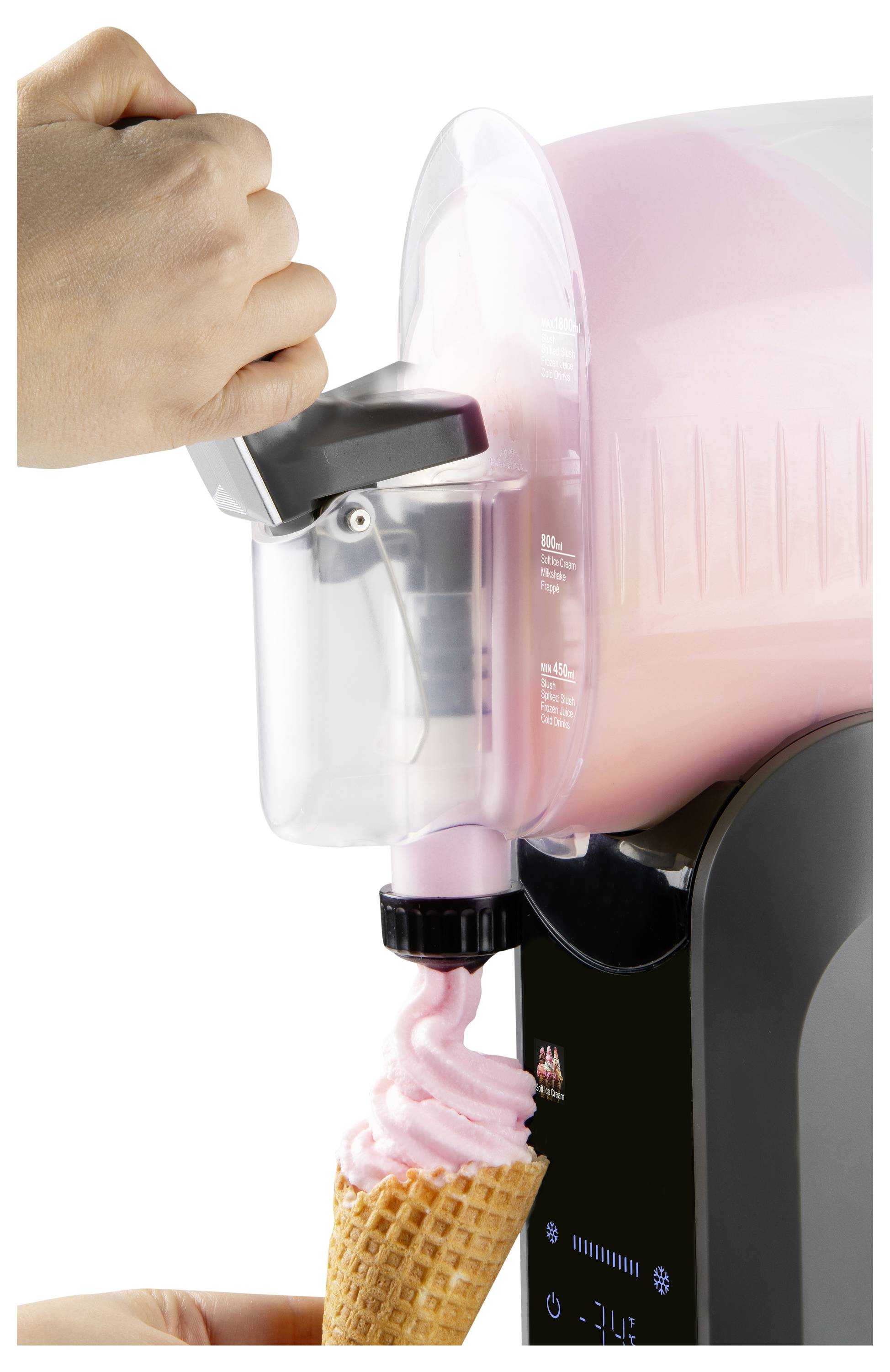 Hand holding a soft-serve machine dispenser as pink ice cream fills a waffle cone.