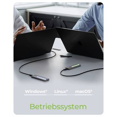 Two laptops linked by cables on a table, suggesting cross-platform connection; text reads 'Windows', 'Linux', 'macOS', and 'Betriebssystem'.<br>