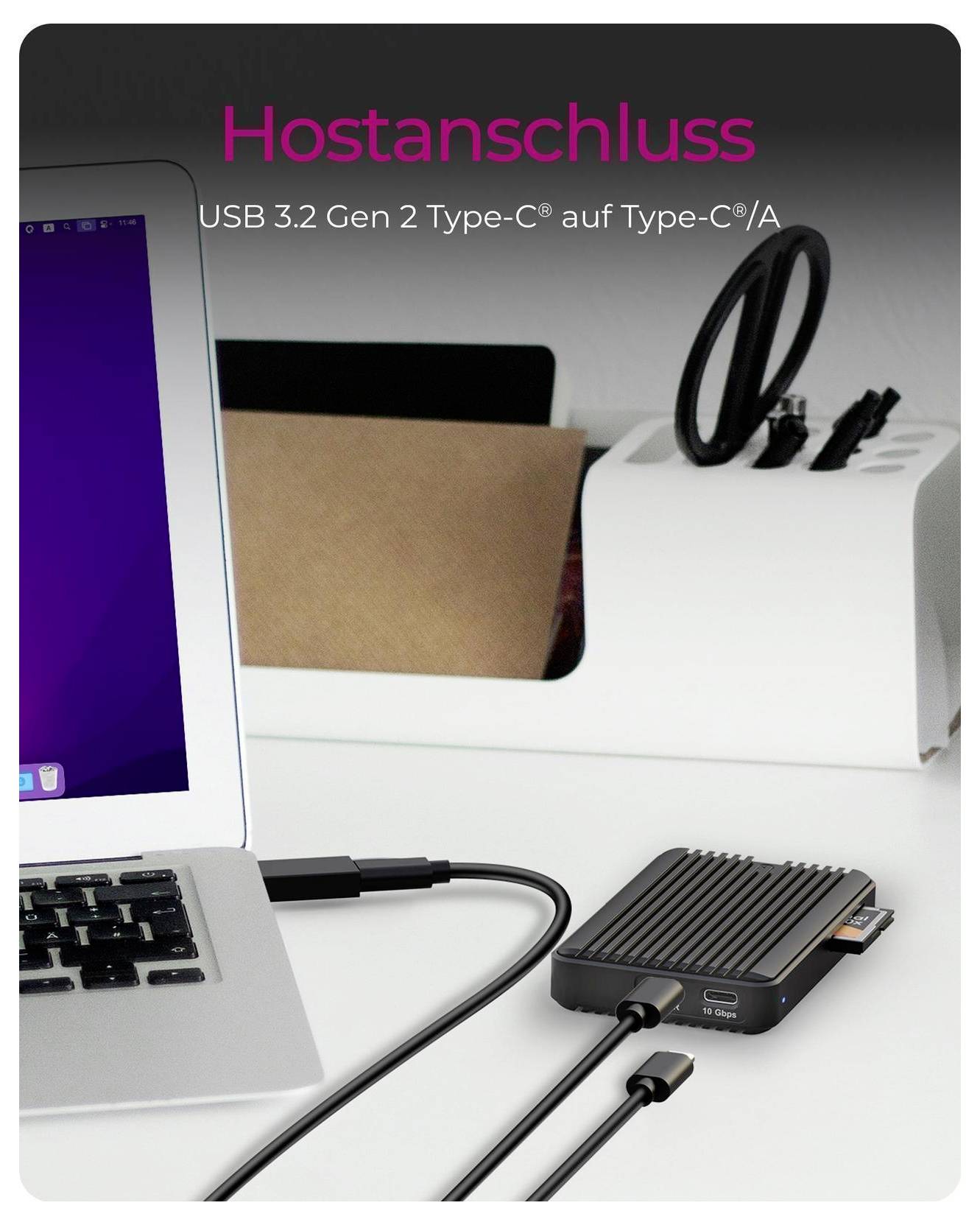 Laptop connected to a compact black USB hub; text reads 'Hostanschluss' and 'USB 3.2 Gen 2 Type-C® auf Type-C®/A'.