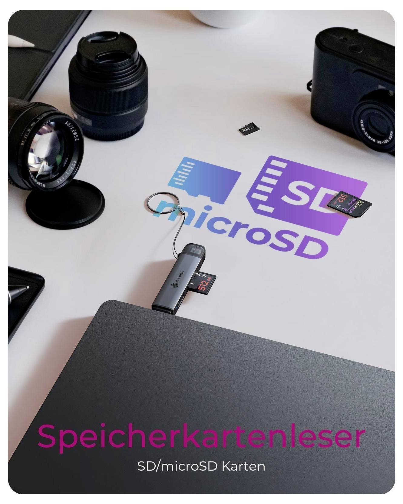 SD/microSD card reader with inserted microSD card, shown on a desk with camera lenses and German text 'Speicherkartenleser' and 'SD/microSD Karten'.