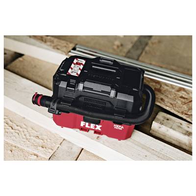 Red and black FLEX HEPA vacuum sitting on a wooden floor, viewed from above.<br>