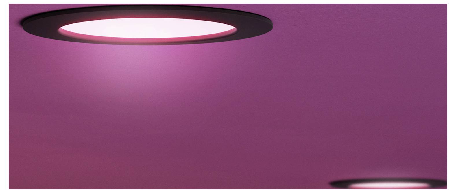 Abstract pink background with glowing white oval light rings partially visible at the top and bottom edges.