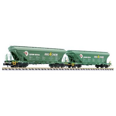Two green AIL4CHEM freight rail hopper cars on tracks, shown side by side with ladders and yellow fittings.