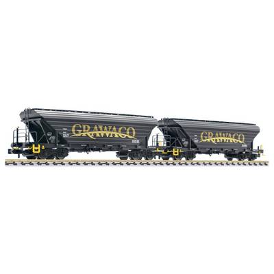 Two black GRAVACO hopper railcars on tracks, shown side by side, with yellow lettering and gray roofs.