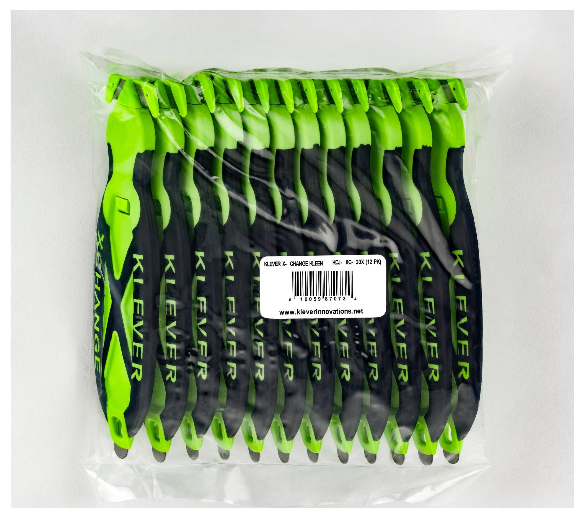 Clear plastic bag containing a pack of 12 black-and-green 'KLEVER X' utility knives, labeled with product details and website.