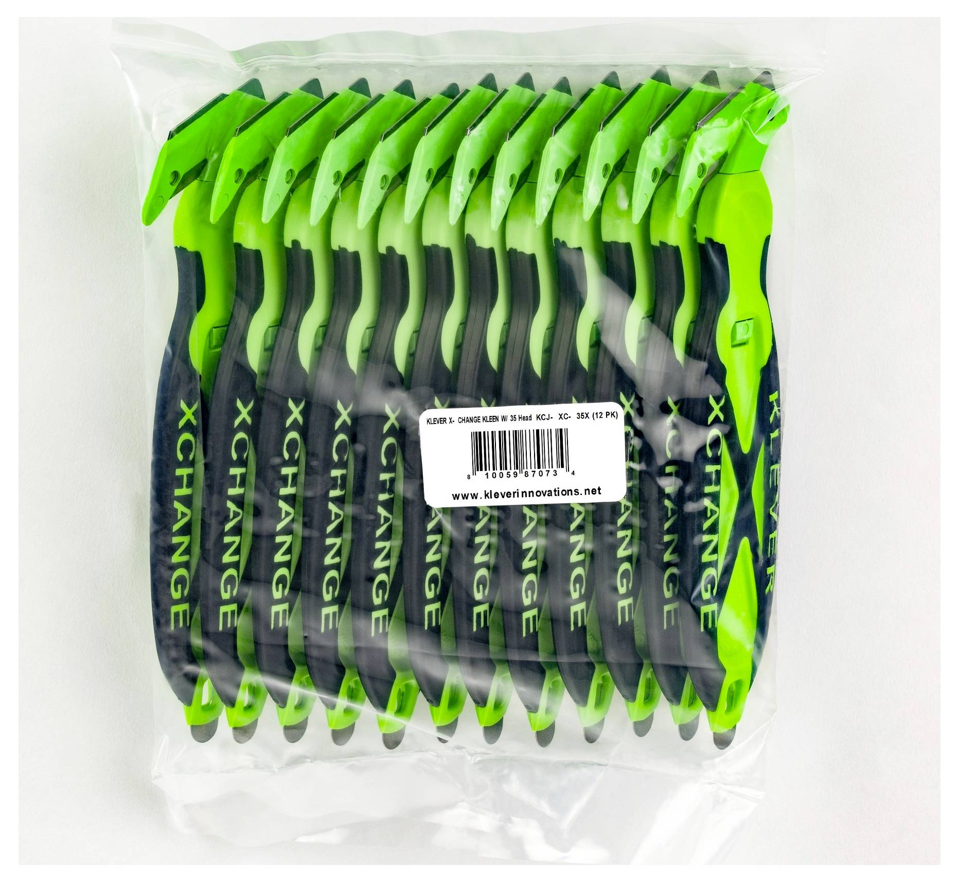 A sealed plastic bag of multiple green-and-black XCHANGE handheld tools or pens arranged in a row, with a product barcode label in the center.<br>