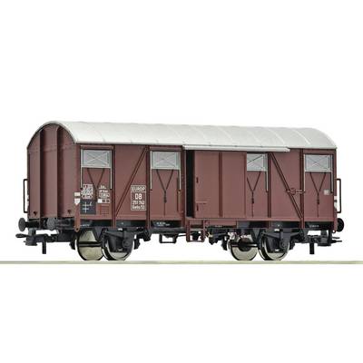 Maroon freight railcar with a curved white roof, sliding doors, and black wheels shown in side view on a white background.